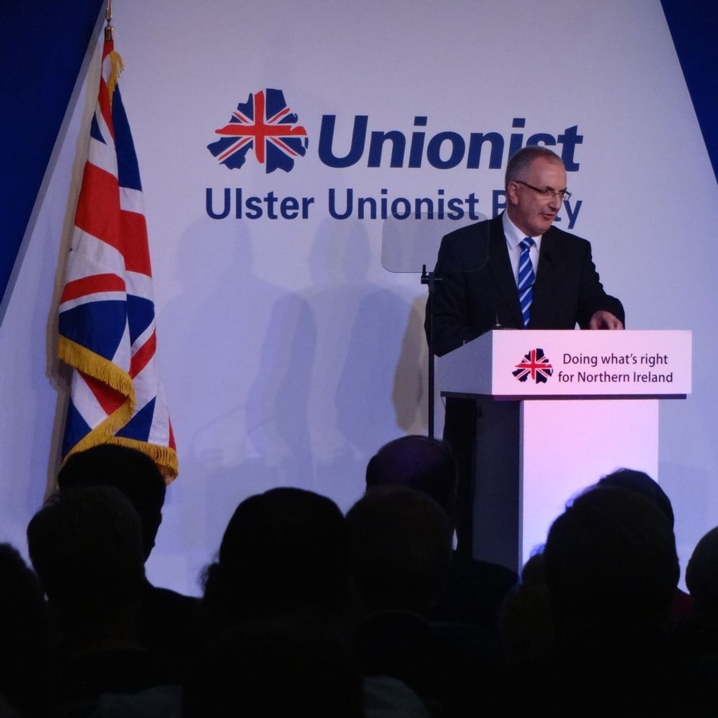 DRD Minister Danny Kennedy addresses #UUP2014 conference and takes a pop at fellow ministers episode artwork
