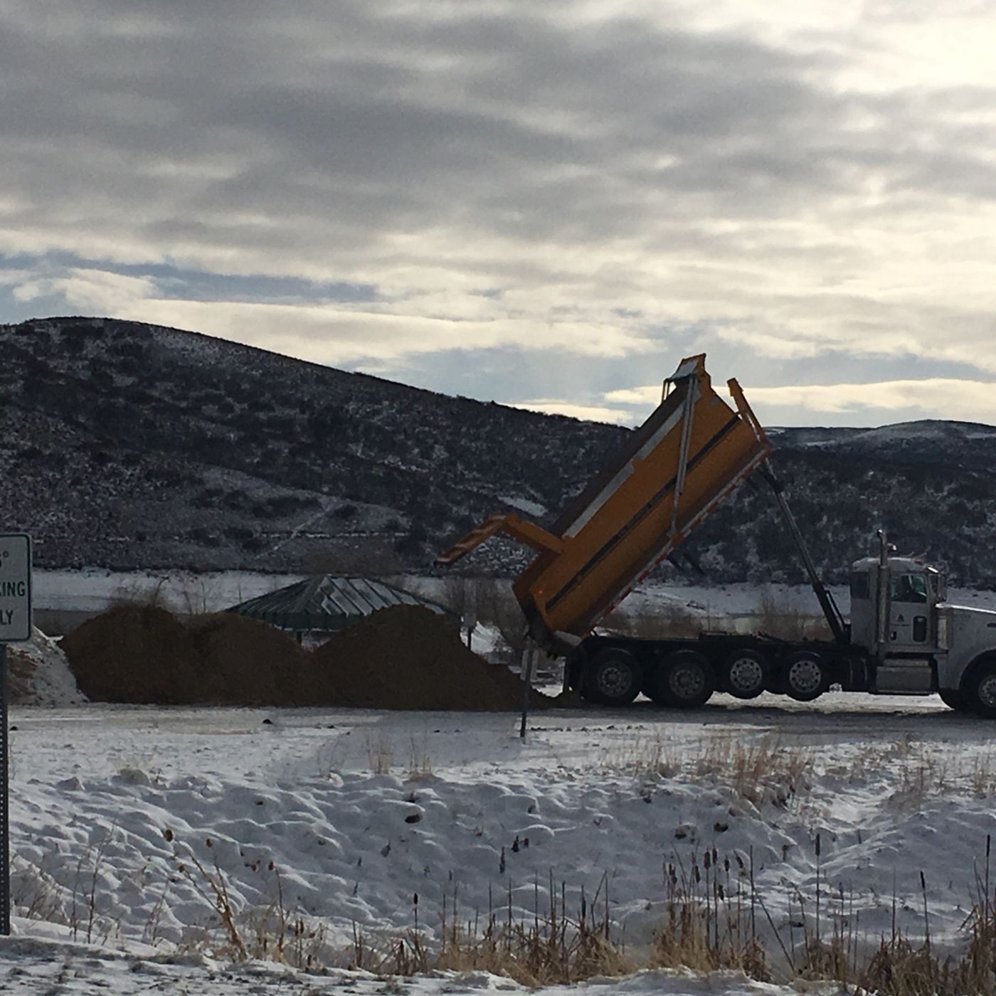 Sand mixes with snow for Jordanelle beach building episode artwork